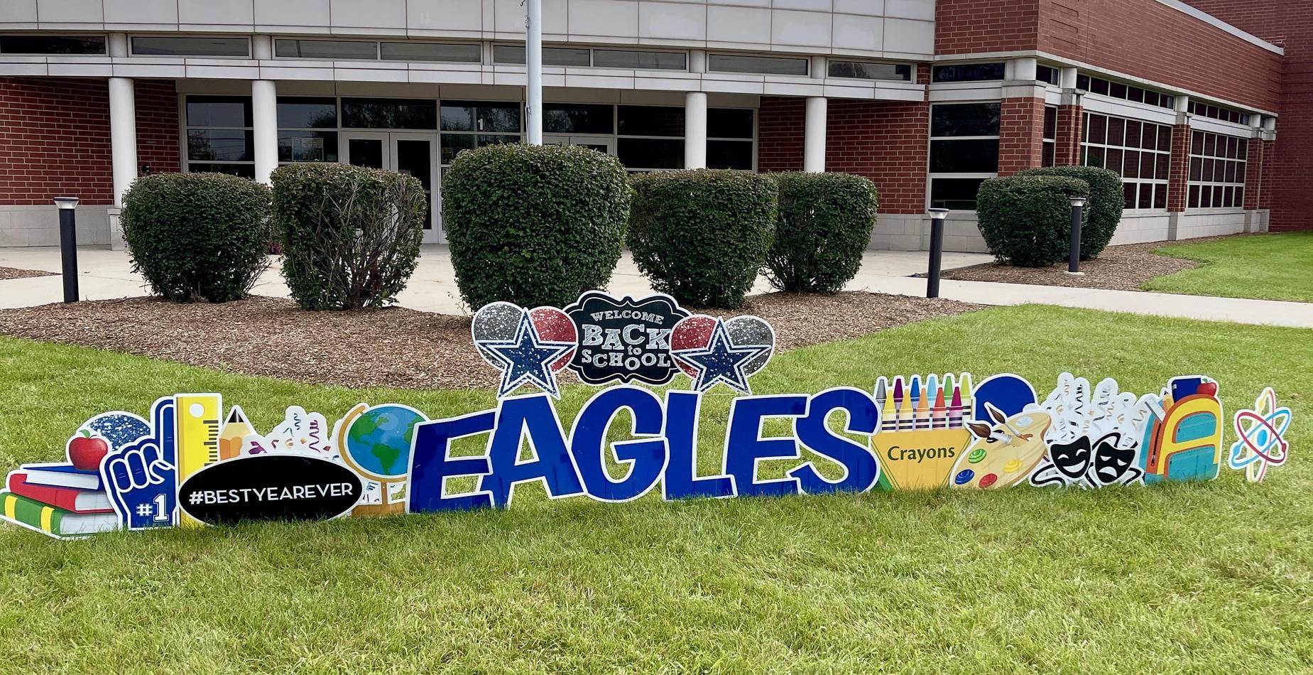 Welcome Back to School Eagles signage in front of school.