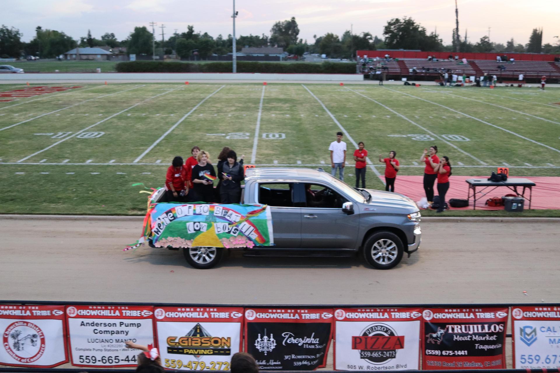 students, staff, and community members enjoying Friday night at the football game