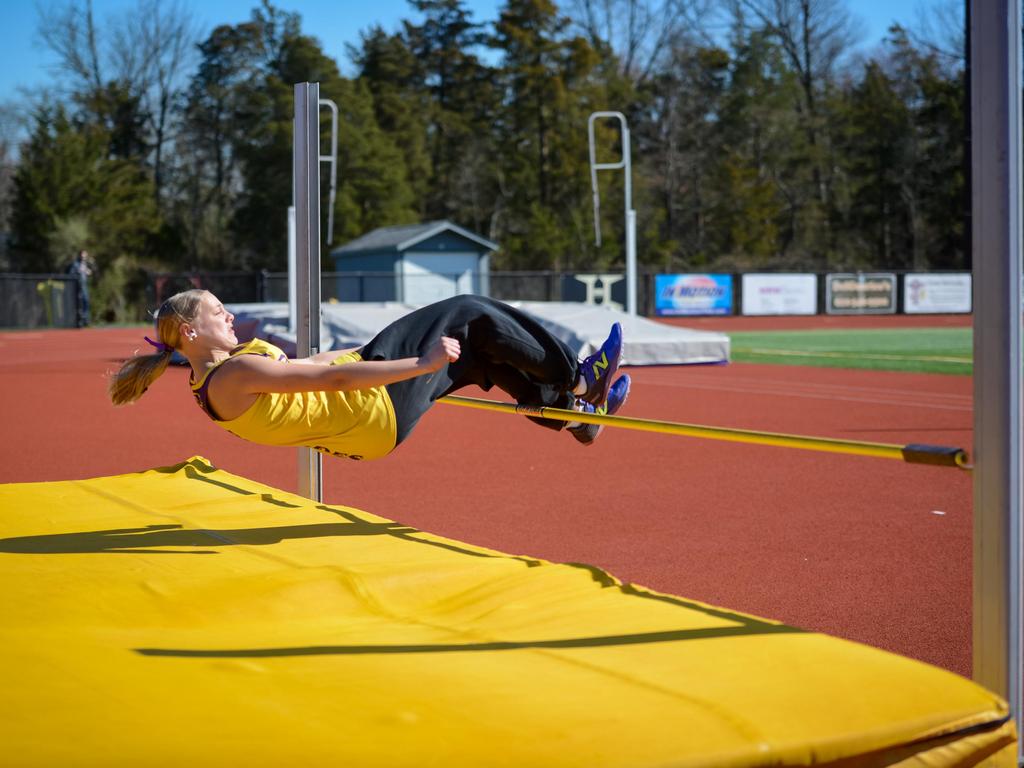 A track & field student athlete on the high jump.