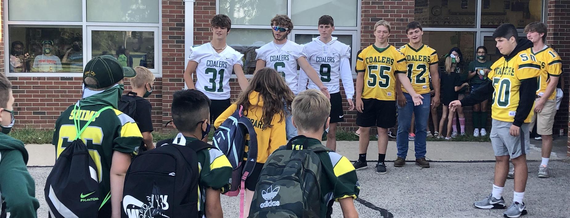Football players visit the IS