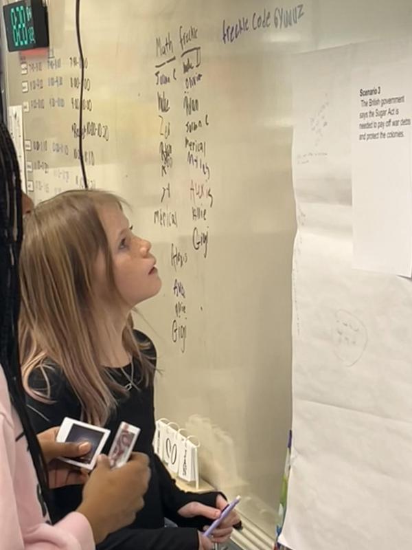 Student looking at a white board