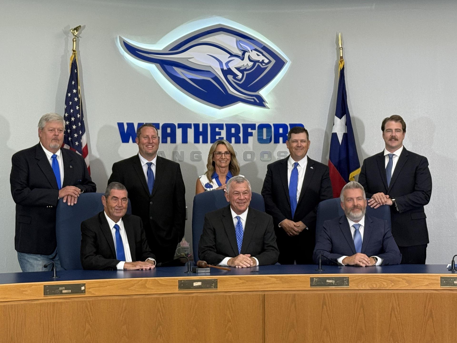 picture of all board members in front of kangaroo logo