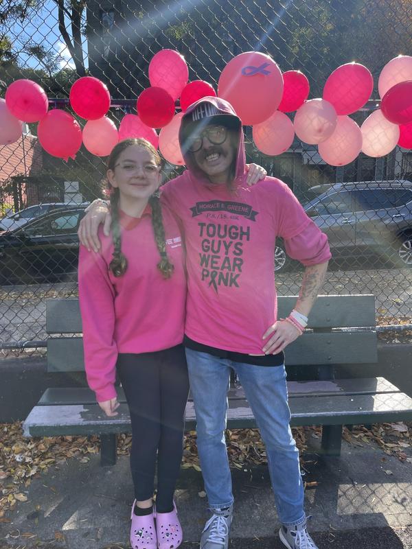 Parent and daughter supporting the cause