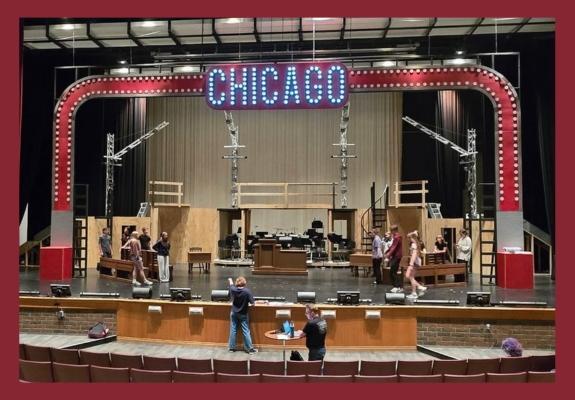 Chicago Teen Edition stage prepared for the musical with set staff working in background