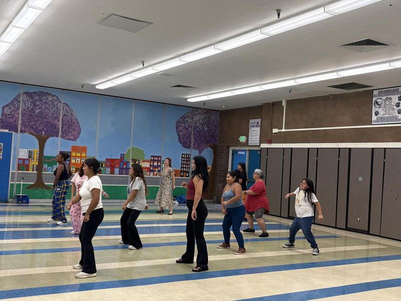 Cochran families dancing together at Zumba with the Principal