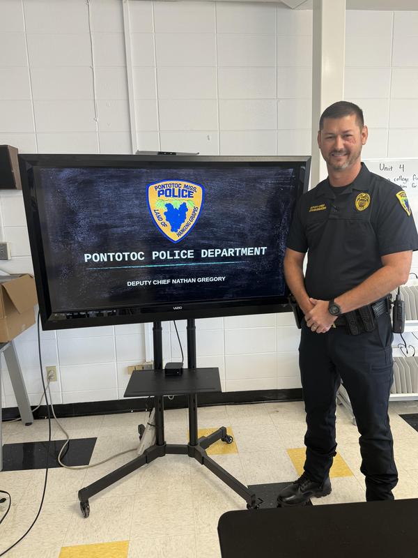 Deputy Chief Nathan Gregory  standing in the classroom