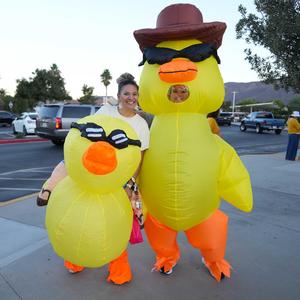 two staff members dressed in duck inflatable costumes