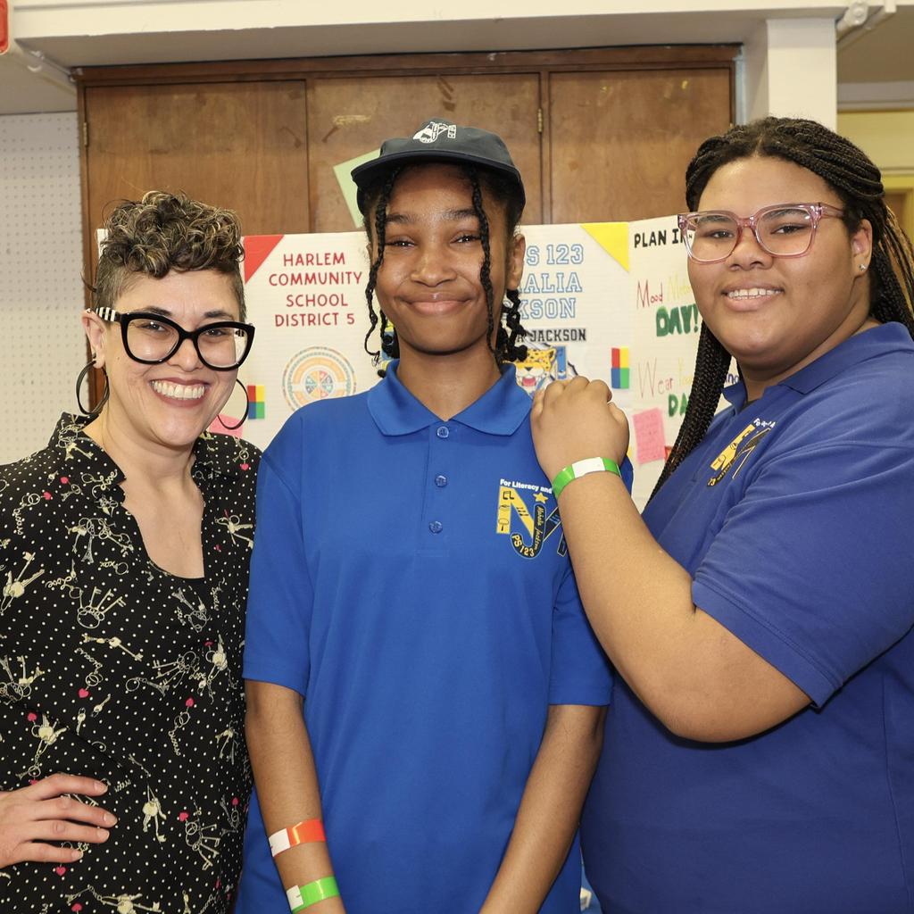Students taking picture with teacher