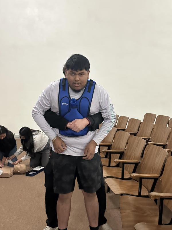 Senior students learning CPR.