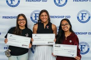 Kianah Aldaco posting with character scholarship check