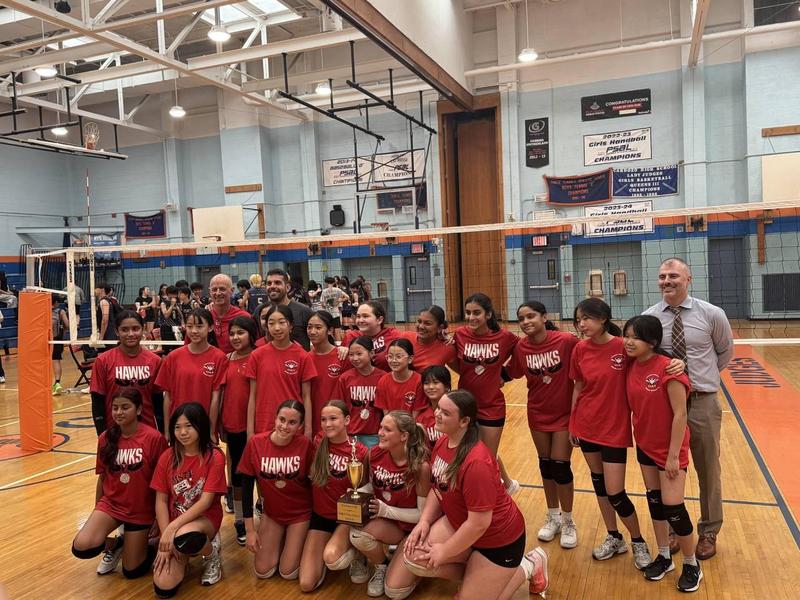 girls volleyball team after winning championship game