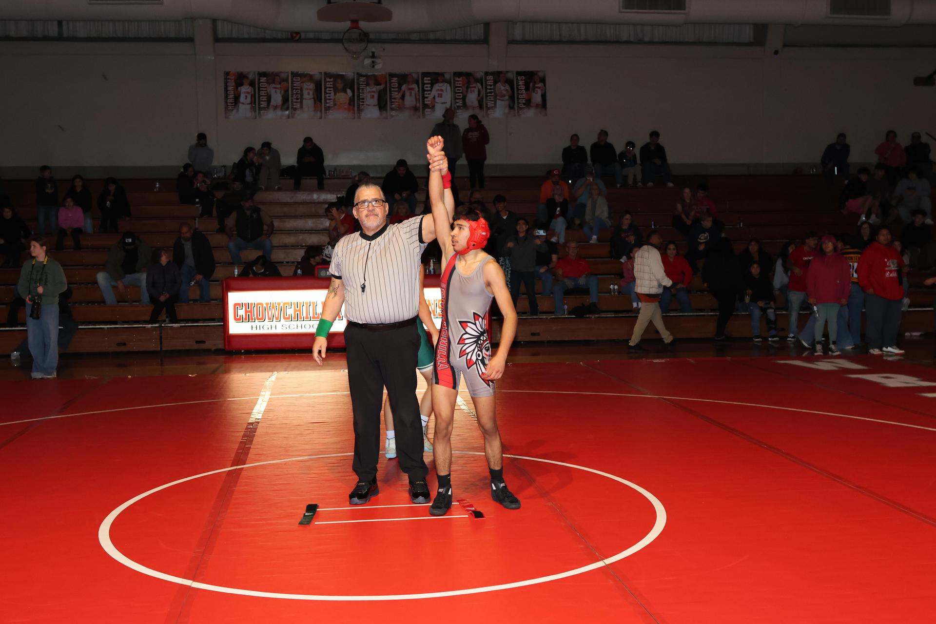 Wrestling winners with hands up 139