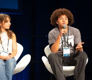 Cayden Bristow speaks on the panel