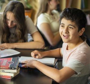Two students sitting at desk working