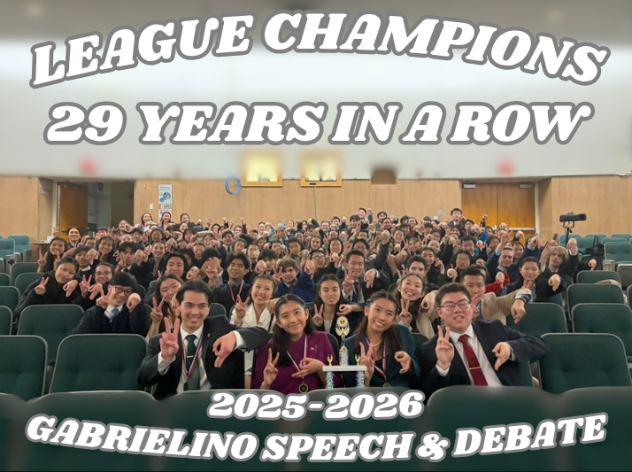 team sitting in auditorium