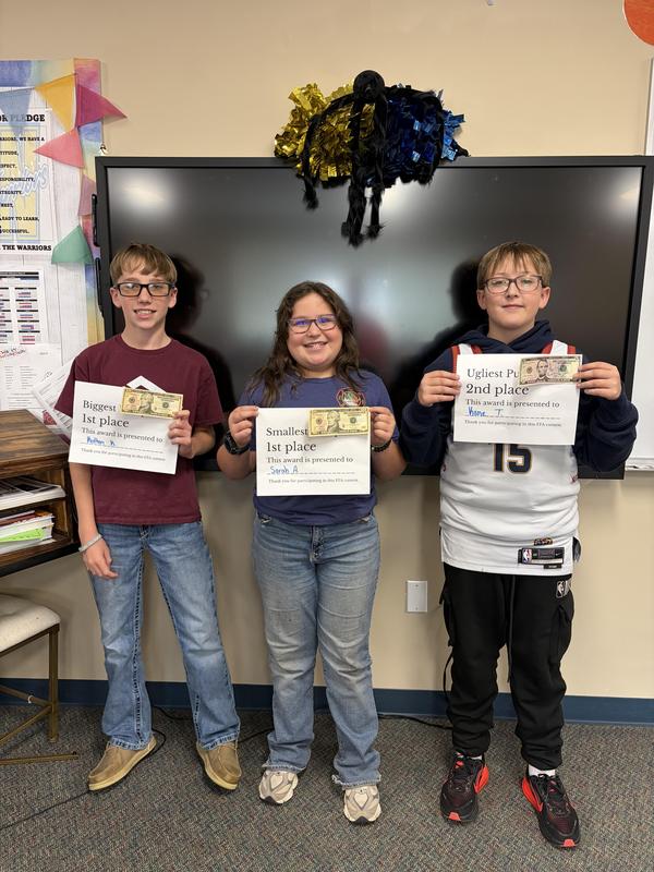 Students showing off their awards.