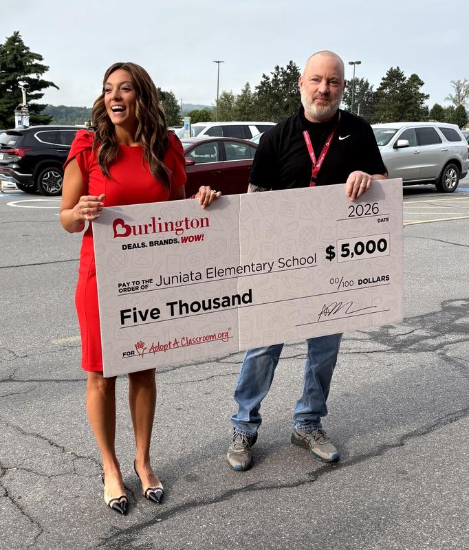 Dr. Anzinger recieving giant check from Burlington