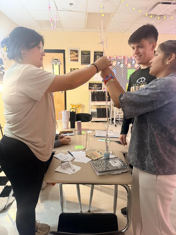 students standing as they work