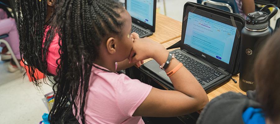 Elementary student using Chromebook