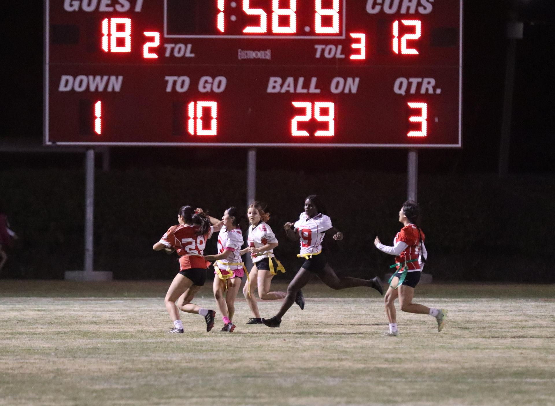 girls playing flag football