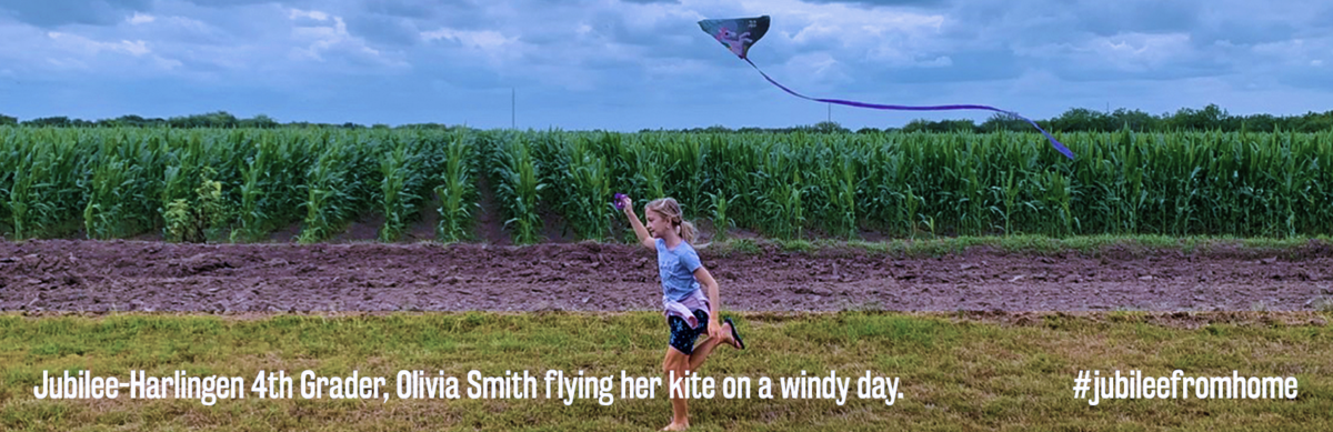 girl running thru fields