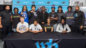 Brown and Turner with a batch of college bound students