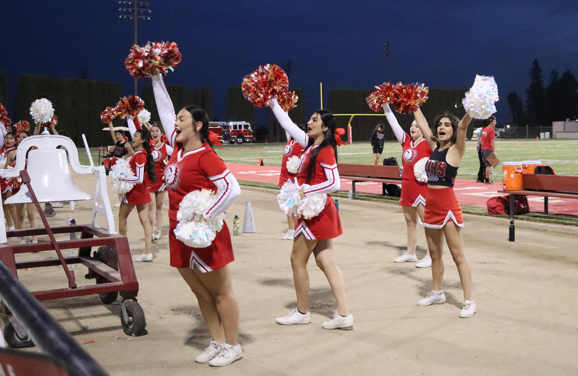 varsity cheerleaders in action at the Riverdale game
