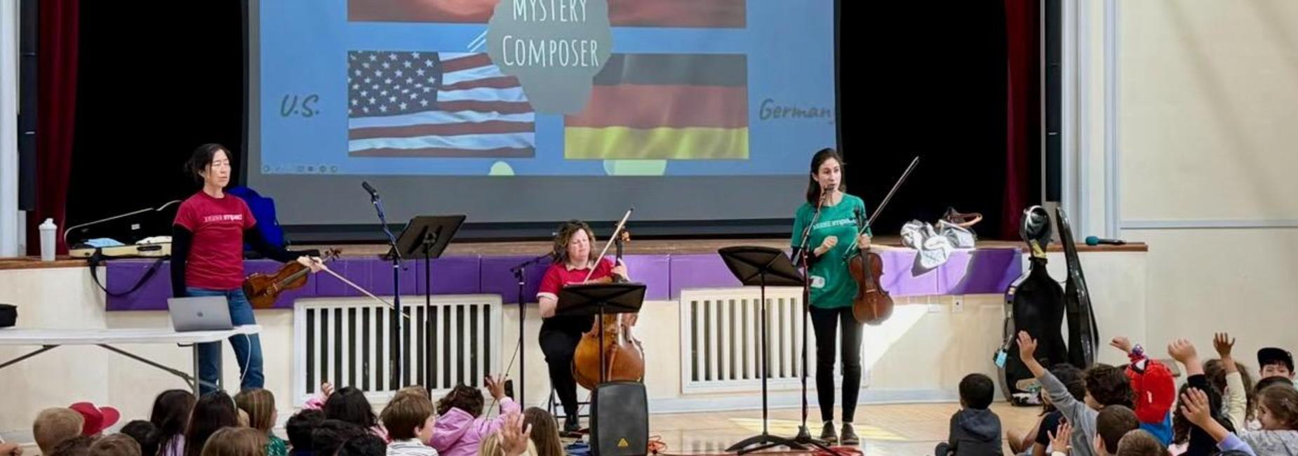 Students enjoy a musical performance.