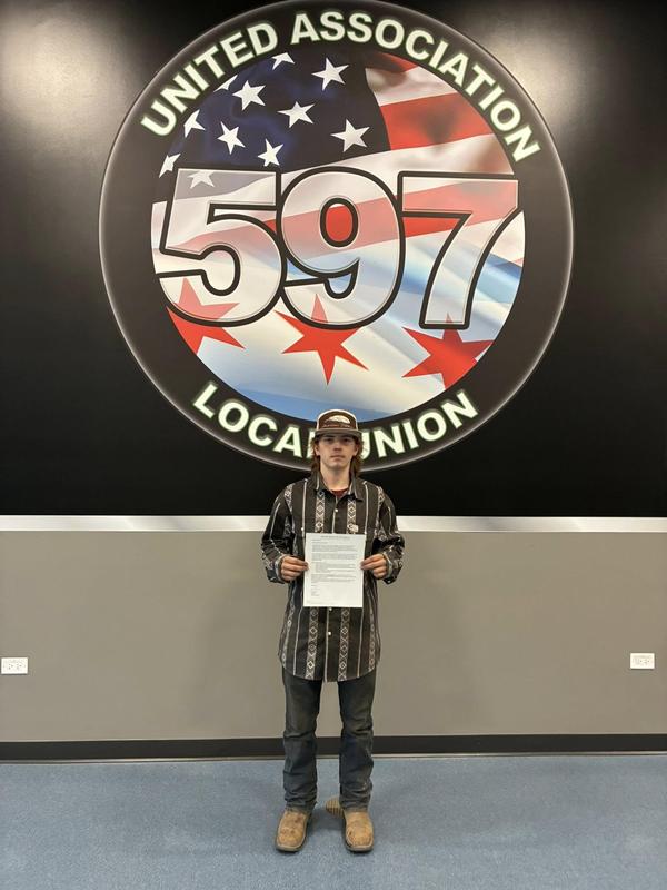 student holding certificate