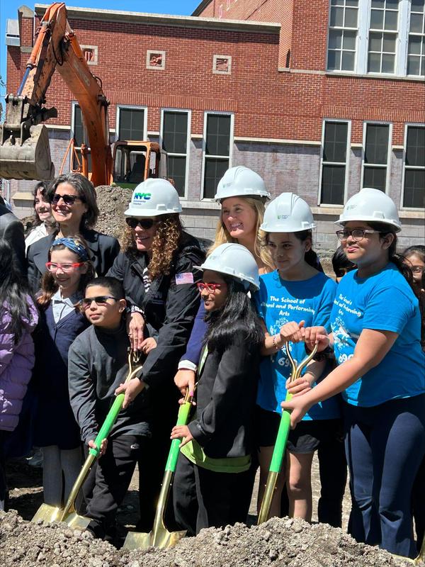 people with shovels at ground breaking ceremony