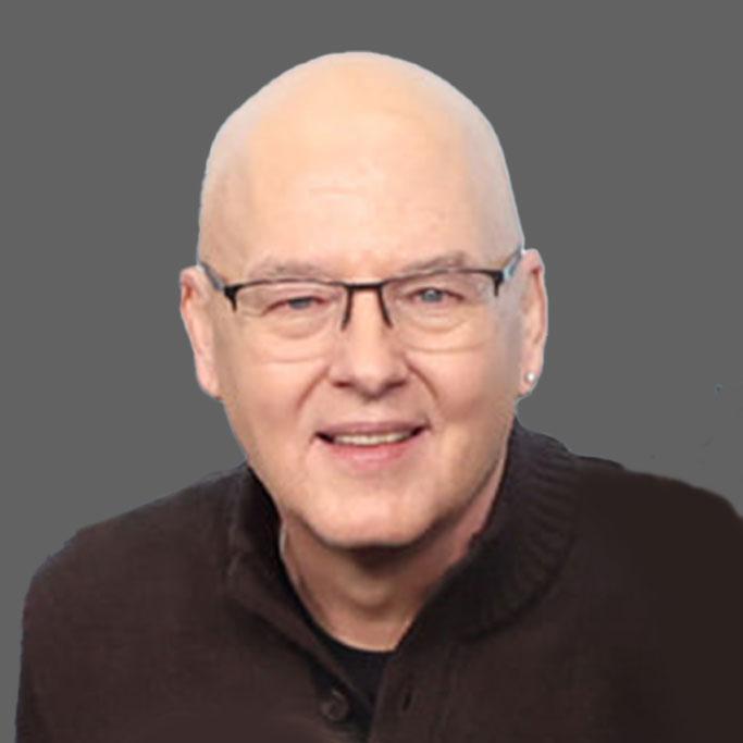 Balding man with glasses