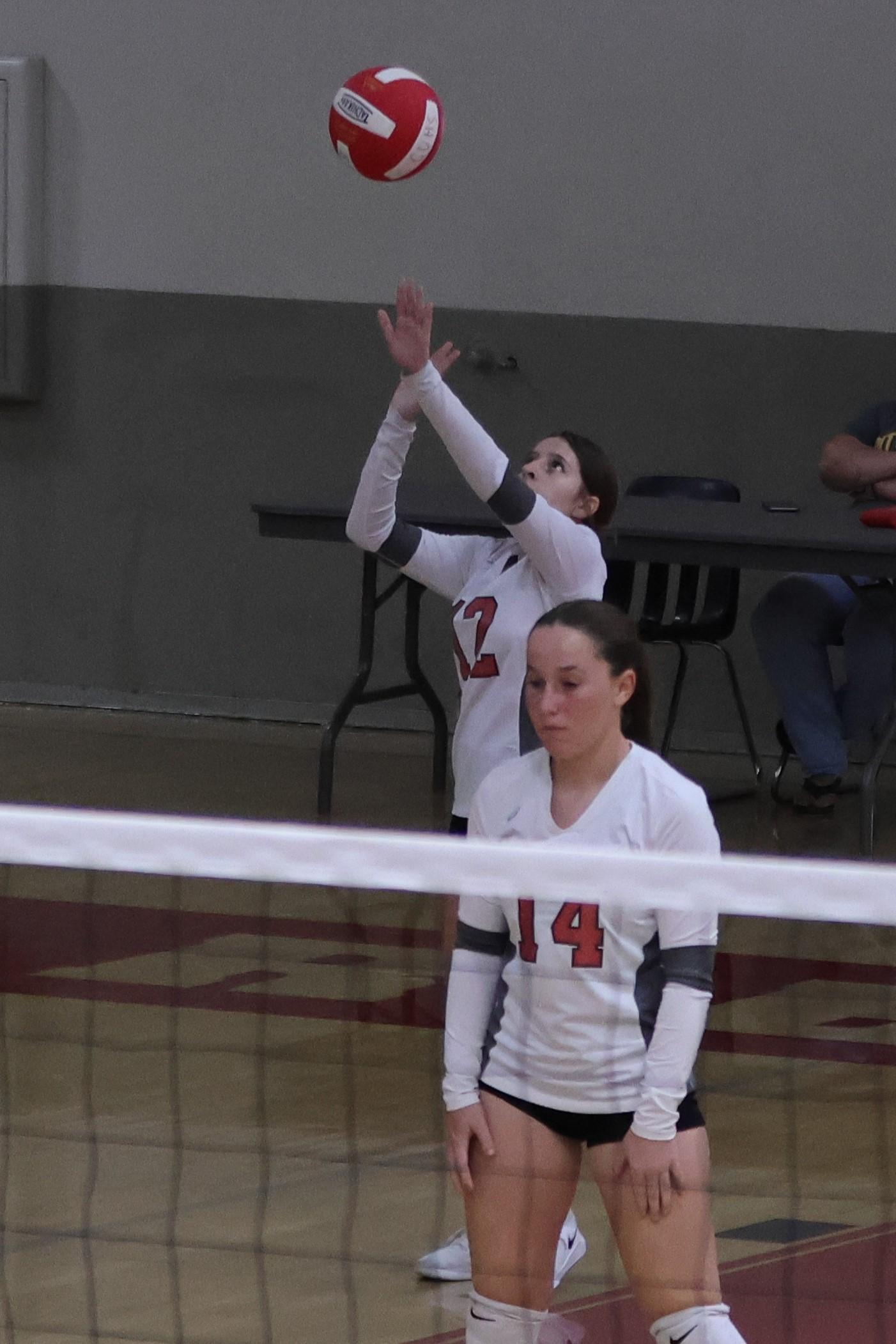 junior varsity girls playing volleyball 85