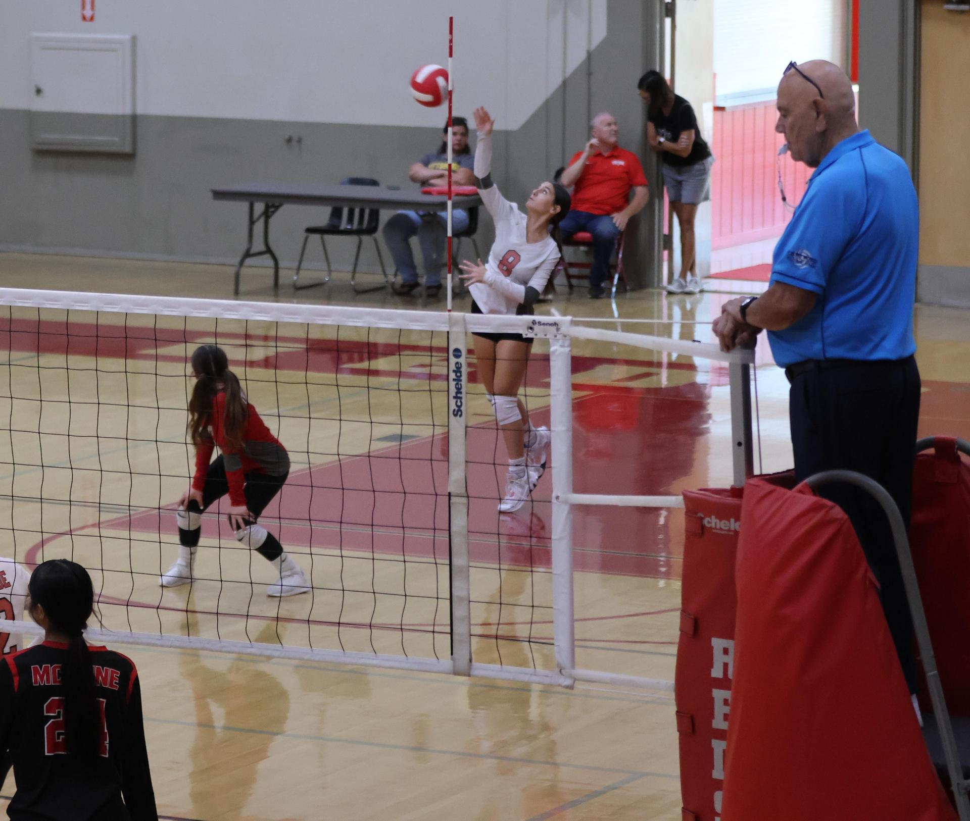 junior varsity girls playing volleyball 124
