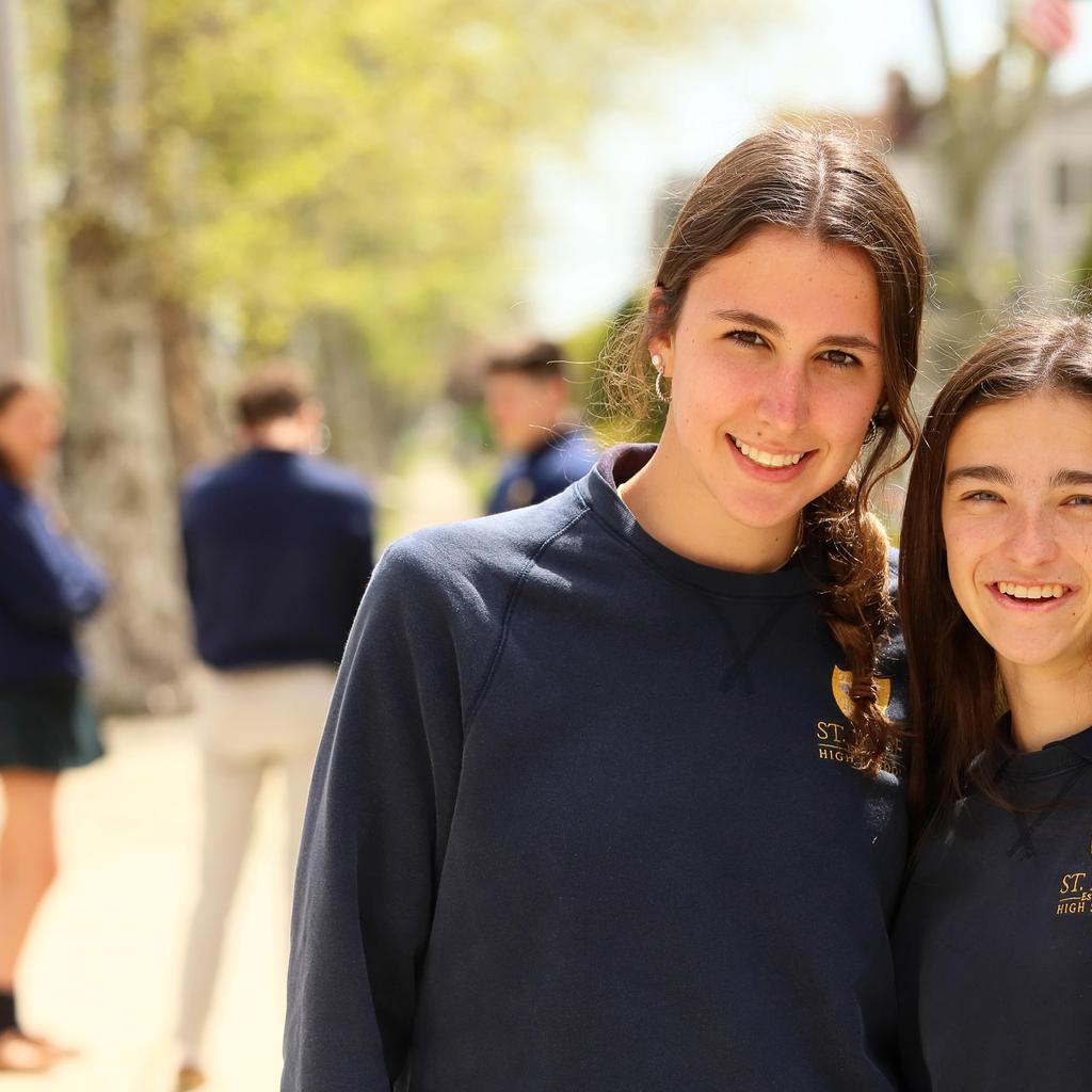 students in front of school