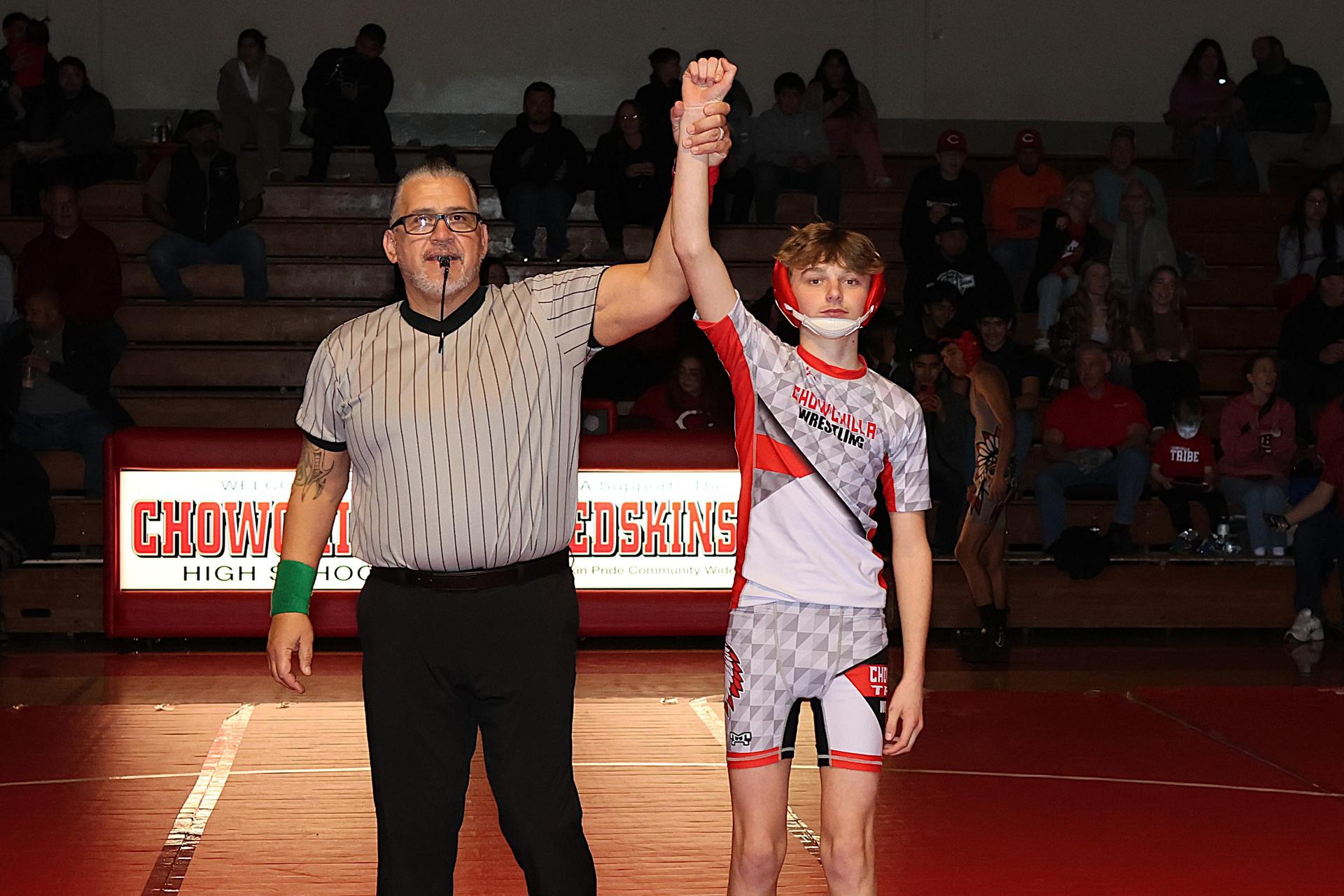 Wrestling winners with hands up 17