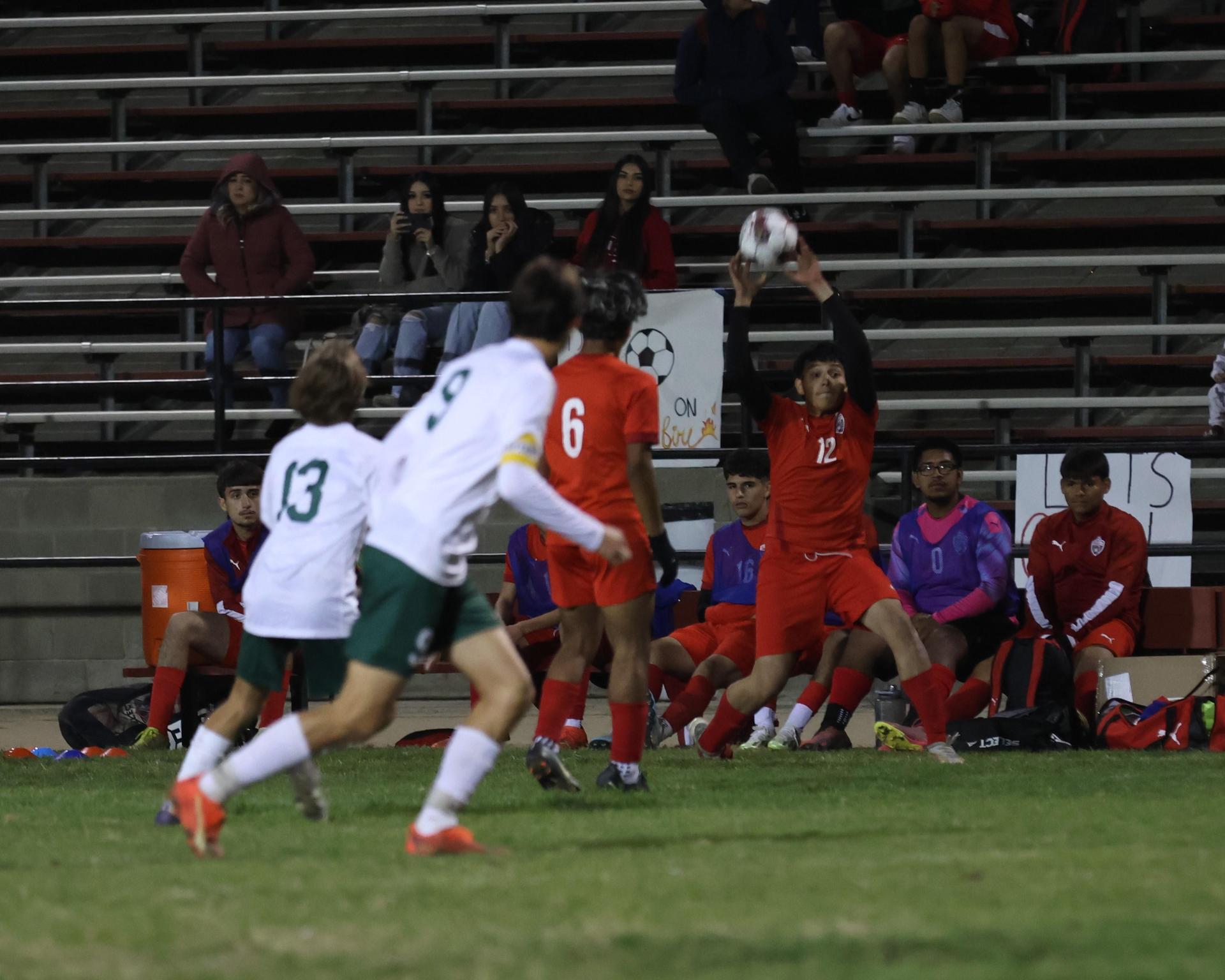 Varsity boys play soccer against Kingsburg