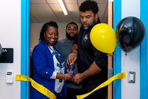 Dr Manns and Cam cut the ribbon