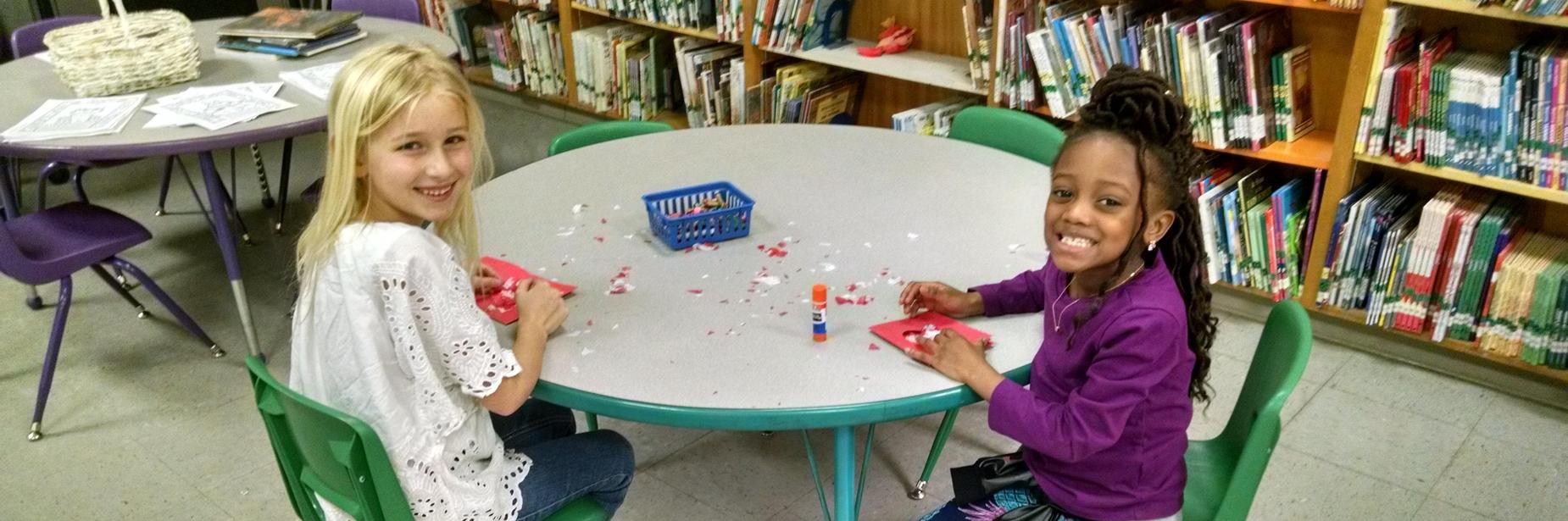 Girls making valentines