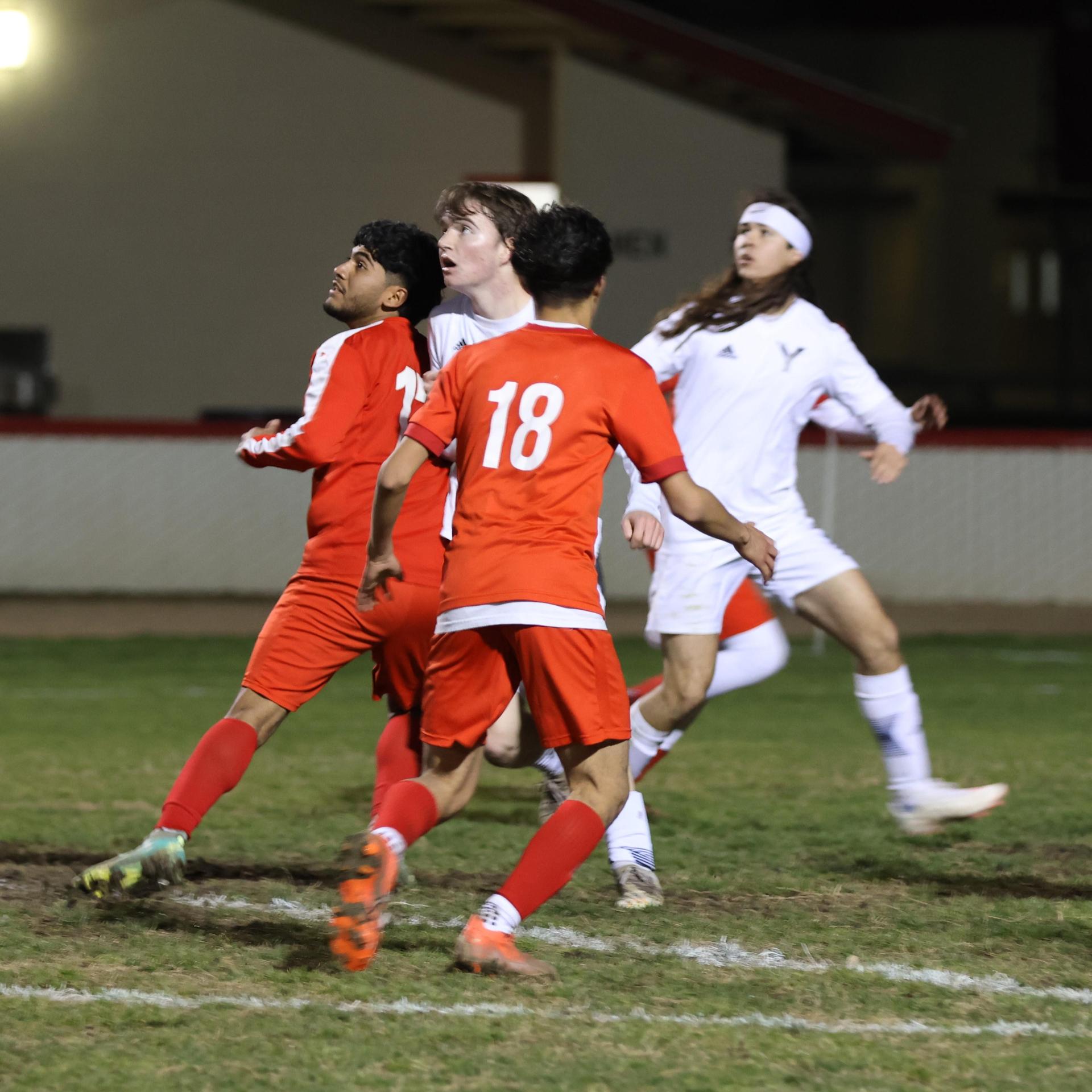 varisty boys soccer playing against yosemite