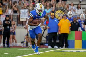 chase campbell running with football