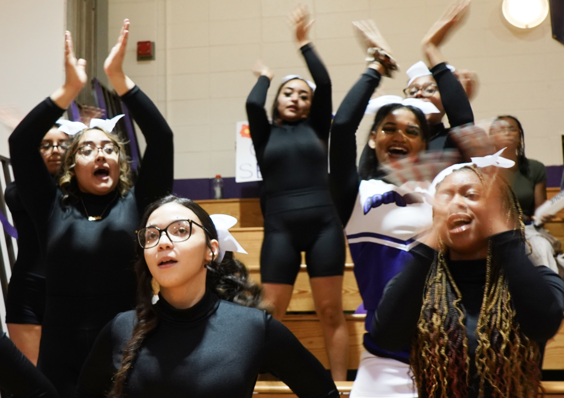 Cheerleaders cheering in the stands