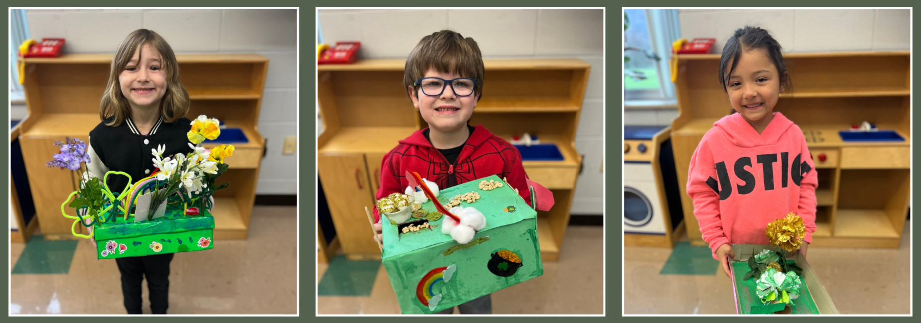 Three students holding class projects