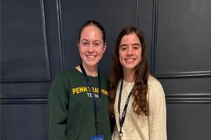 Mia Williams and Annabelle Aquino stand in a hallway