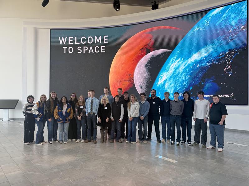 Students in front of the launch wall