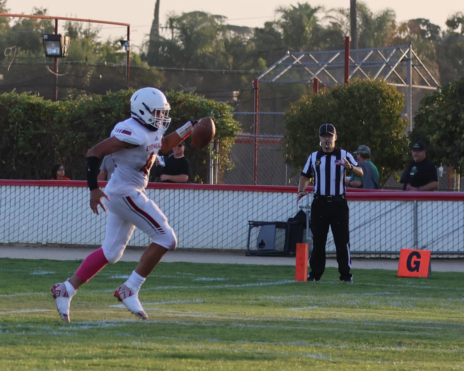 Junior Varsity football players in action against Caruthers