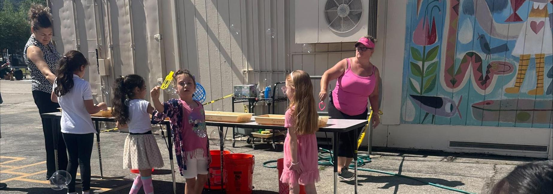 Students blowing bubbles at the spring Family Festival 2026