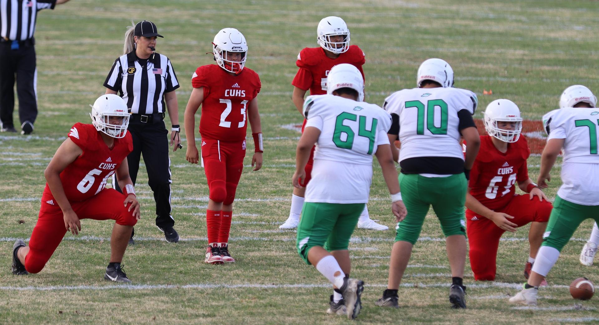  junior varsity football players in action against riverdale