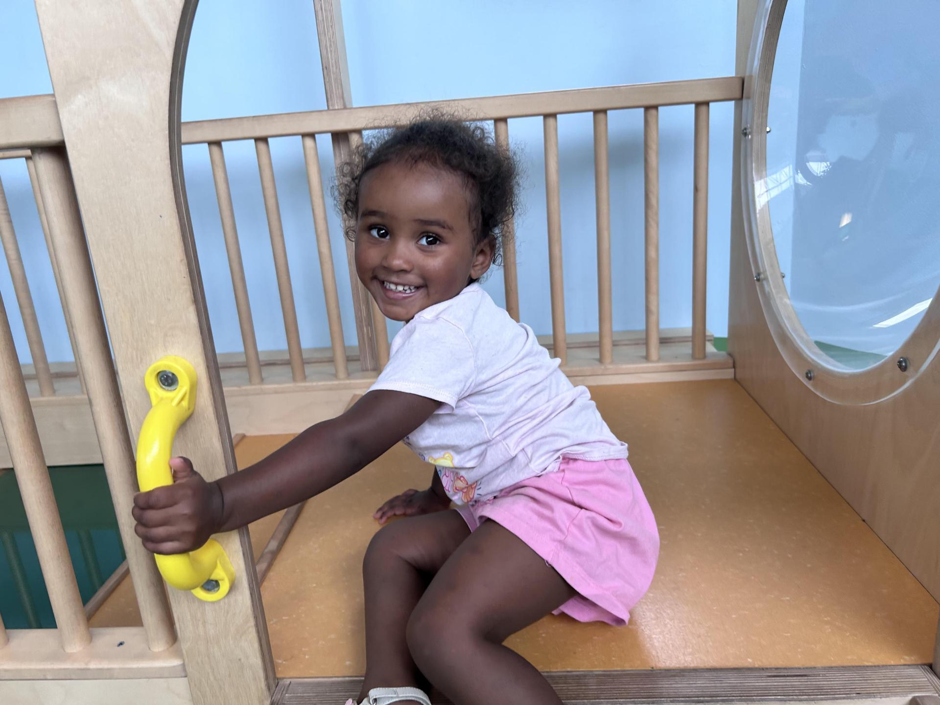child playing in gym