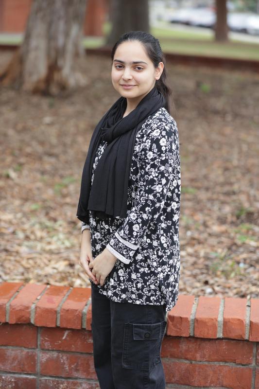A female student from Santa Fe High School smiles at the camera.