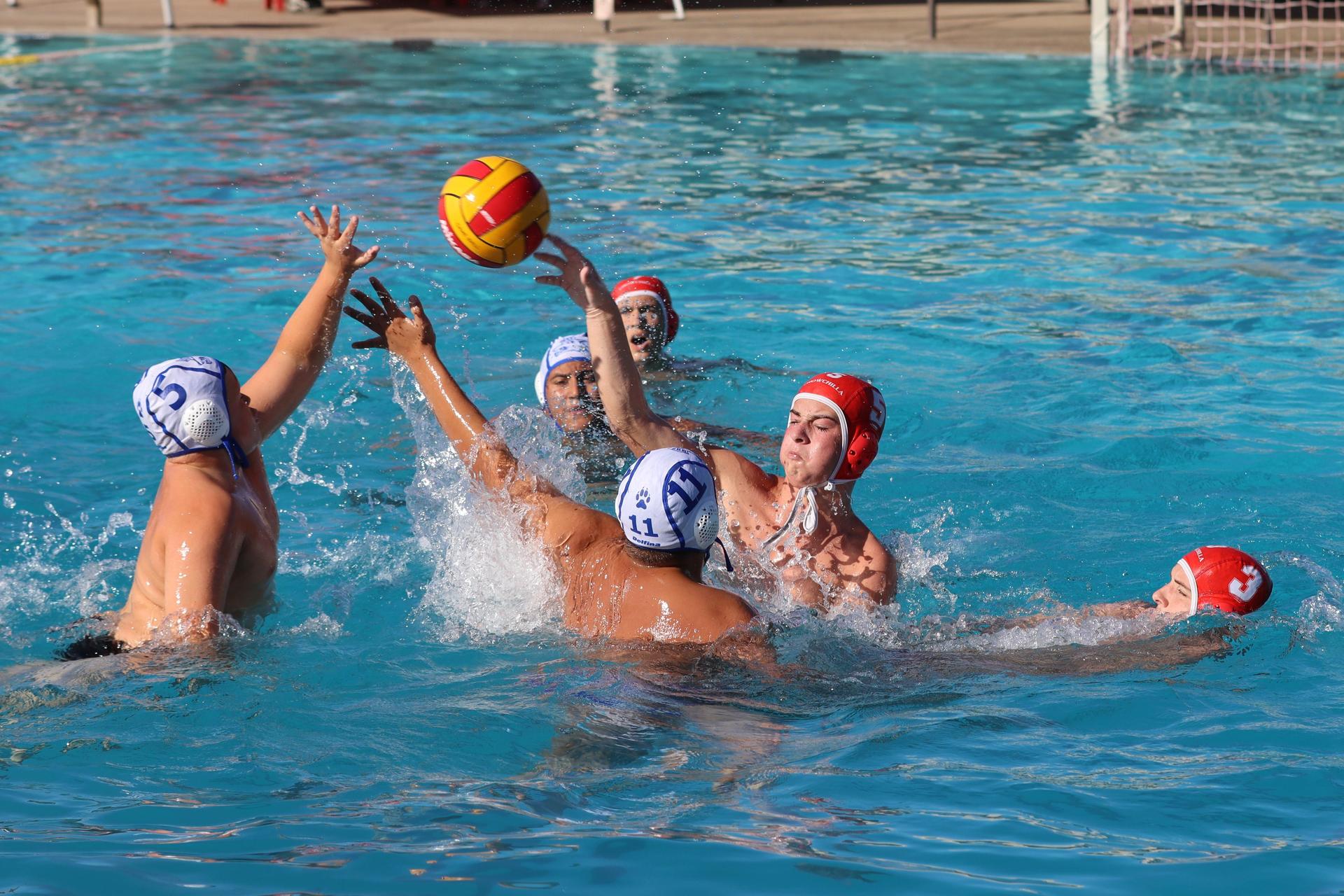 boys playing water polo against Madera